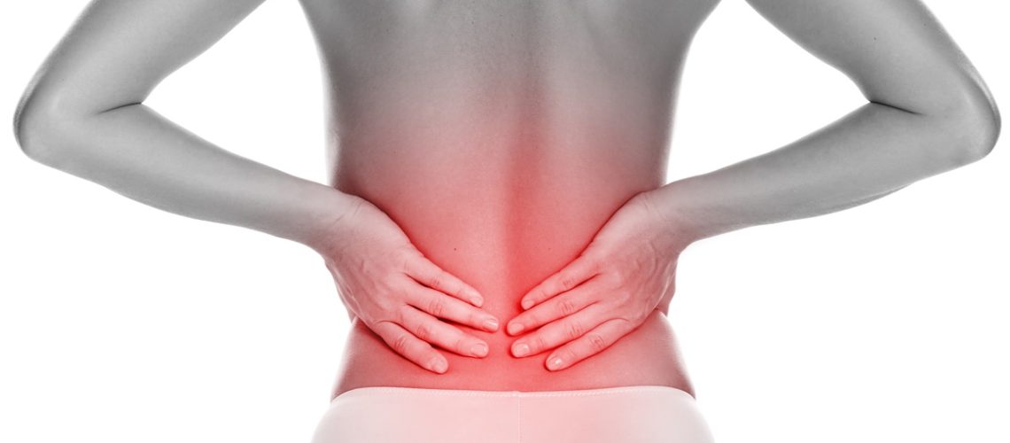Woman with lower pain back on white background