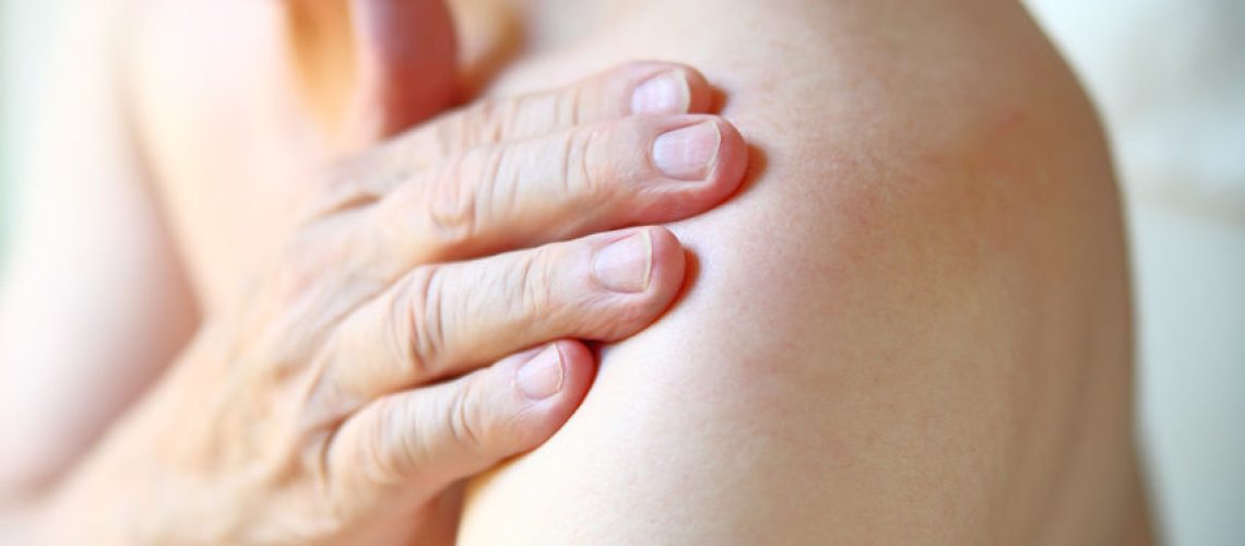 85007315 - senior man with shoulder joint pain closeup